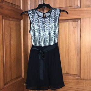 Sleeveless sequin and black dress